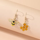 Aretes Colgantees Nid d'Abeja y Abeja - Bijoux Dorados para Mujers 3